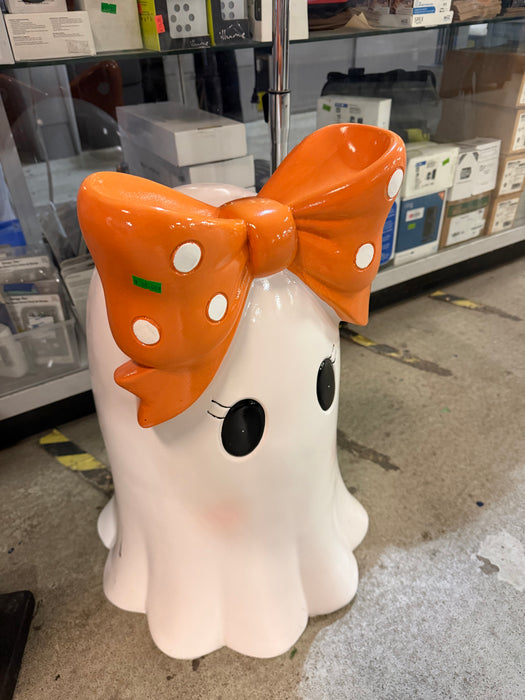 white ghost with orange bow
