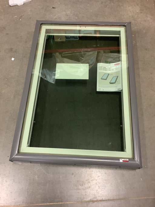 Window with reflective glass on a concrete floor