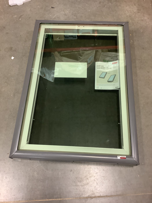 Window with reflective glass on a concrete floor