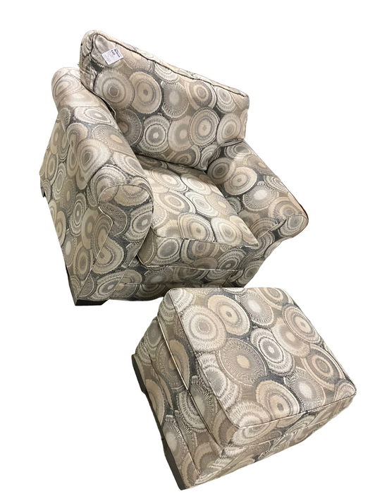 Light-colored armchair with ottoman (used)