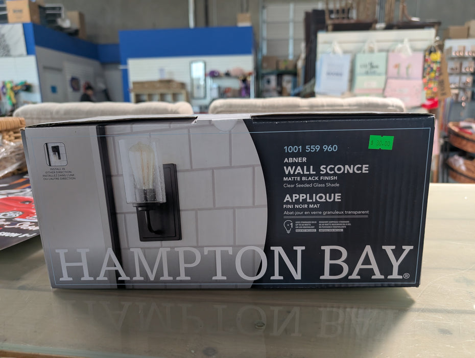Hampton Bay 1-Light Matte Black Modern Industrial Wall Mount Sconce Light with Clear Seeded Glass Shade